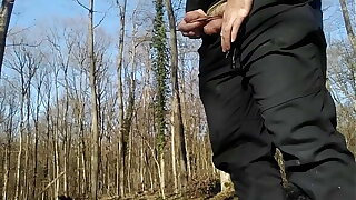 Young guy peeing in the woods with his uncut dick!
